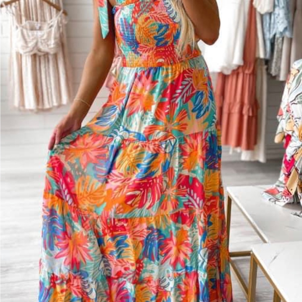 This flirty dress is fitted in the bust Size Medium